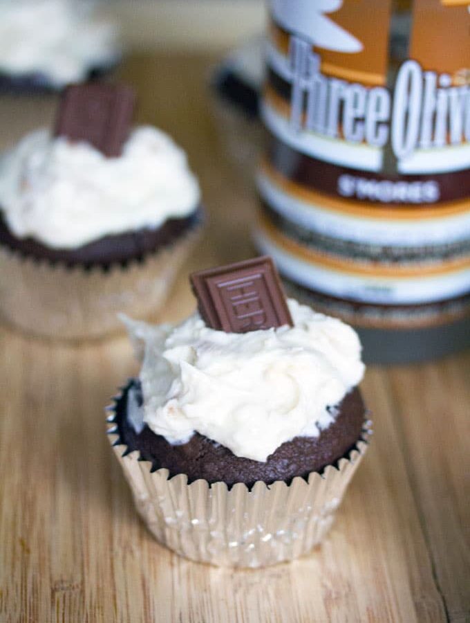S'mores Vodka Cupcakes -- It doesn't get any more delicious than these S'mores Vodka Cupcakes, which involve s'mores vodka in both the cake and the frosting... Plus, they have a marshmallow fluff center | wearenotmartha.com