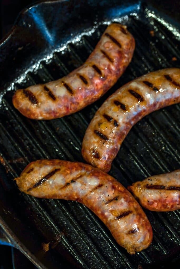 Sausages being cooked in grill pan