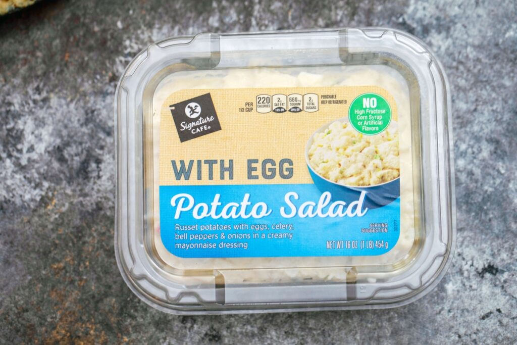 Overhead view of container of Signature Cafe potato salad with egg