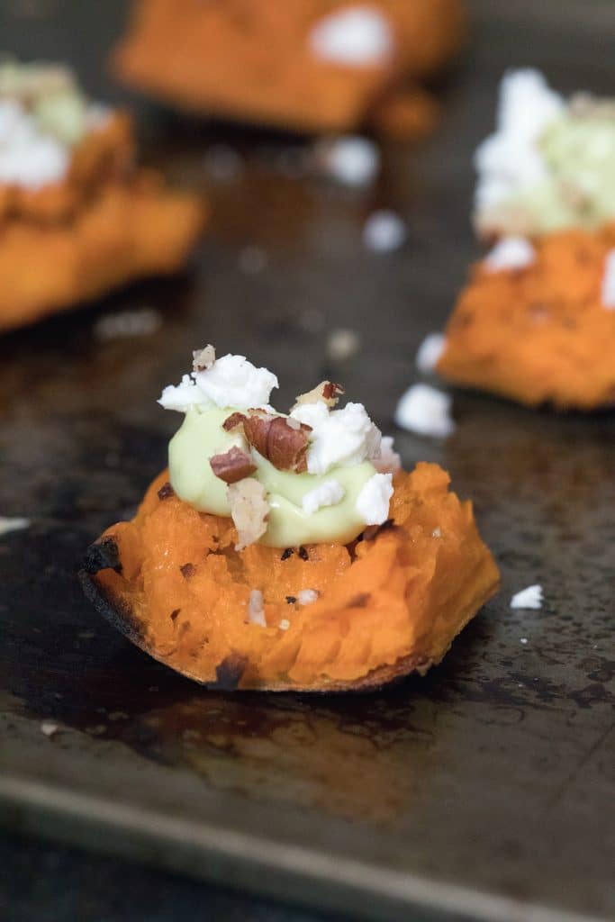 Smashed Sweet Potatoes -- The perfect fall appetizer or side dish, topped with Maple Avocado Crema, goat cheese, and pecans | wearenotmartha.com