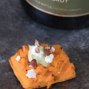 Smashed Sweet Potatoes -- The perfect fall appetizer or side dish, topped with Maple Avocado Crema, goat cheese, and pecans | wearenotmartha.com