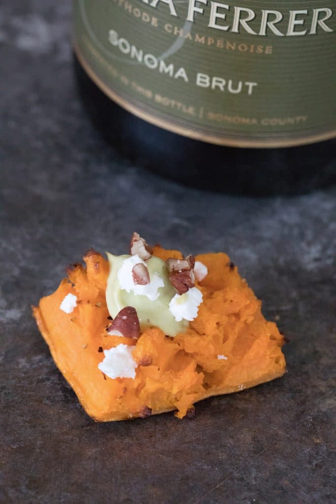 Smashed Sweet Potatoes -- The perfect fall appetizer or side dish, topped with Maple Avocado Crema, goat cheese, and pecans | wearenotmartha.com