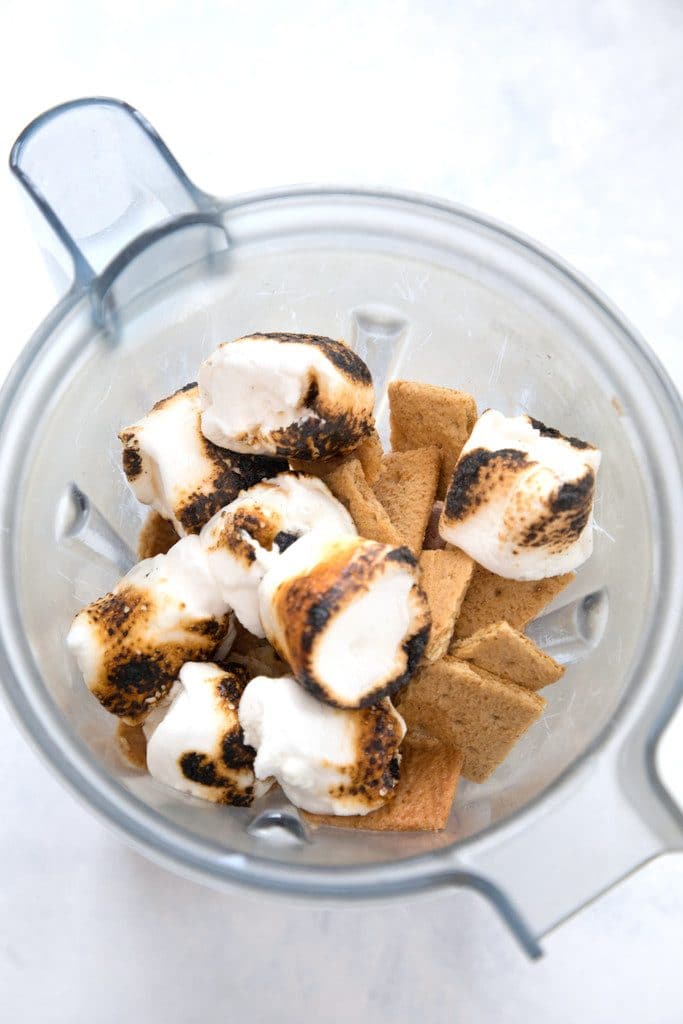 overhead view of blender container containing graham crackers and toasted marshmallows