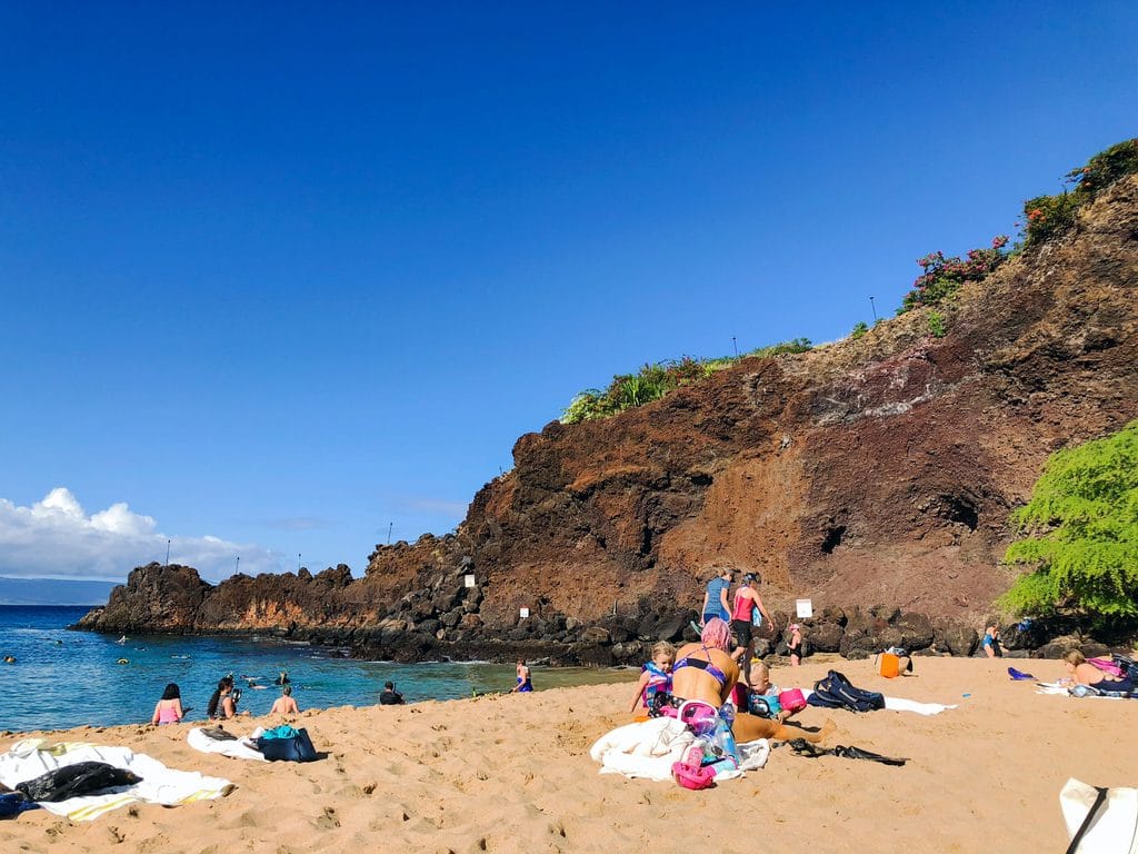 A view of Black Rock on Kaanapali Beach where people are snorkling