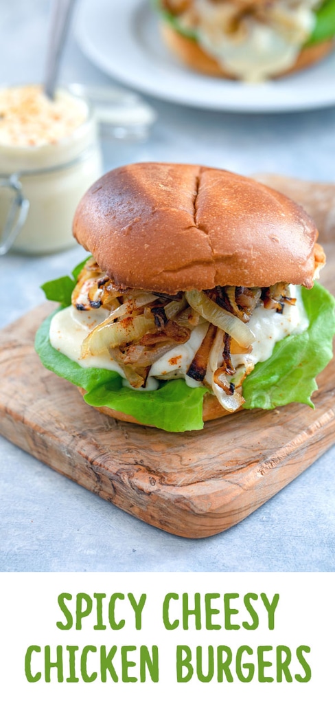 Spicy Cheesy Chicken Burgers -- Chicken burgers don't have to be boring! This Spicy Cheesy Chicken Burger is packed with a flavorful kick, covered in a delicious cheese sauce, and served on a toasted brioche bun | wearenotmartha.com #chicken #burgers #spicy #cheese