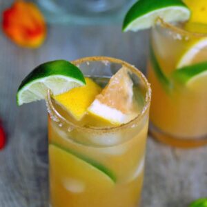 Spicy Roasted Grapefruit Margarita -- This Spicy Roasted Grapefruit Margarita consists of grapefruit that's been broiled and tequila that's been infused with habanero and is the most delicious margarita you'll ever try | wearenotmartha.com