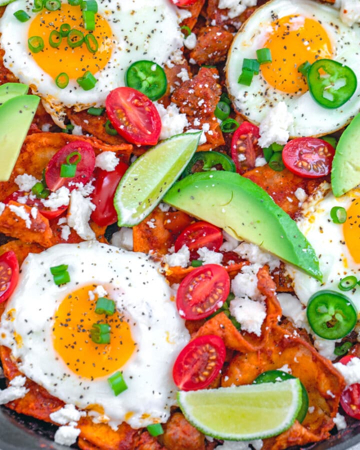 Spicy Sausage Chilaquiles -- This recipe for spicy sausage chilaquiles with eggs consists of homemade corn tortilla chips and red chile sauce, but is still incredibly easy to make. It's packed with flavor and makes for a delicious brunch or breakfast for dinner! | wearenotmartha.com #chilaquiles #sausage #brunch #eggs #breakfastfordinner