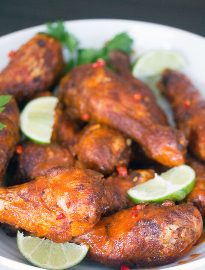 Spicy Thai Drumsticks -- Whether you're looking for a meal or a party appetizer, these Spicy Thai Chicken Drumsticks will satisfy your craving. A little bit of spice and a little bit of citrus helps balance out these drumsticks, making them a surefire crowd pleaser | wearenotmartha.com