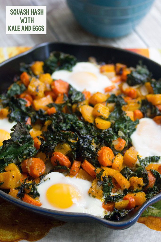 Head-on view of a cast iron skillet with squash hash with kale and eggs with recipe title at top