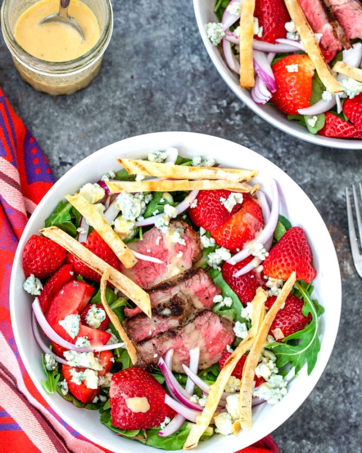 Packed with deliciously satisfying ingredients, this Steak and Strawberry Salad is the ultimate summer salad and requires minimal time standing over a hot stove or grill.