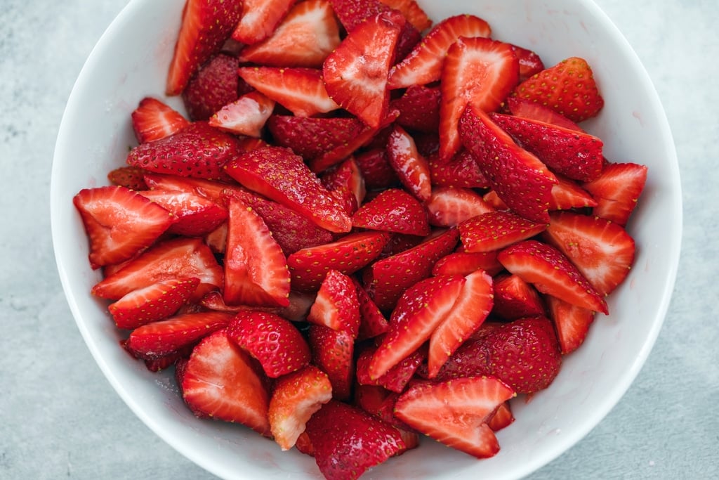Bowl of sliced strawberries.