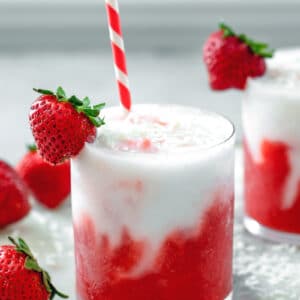 Strawberry Coconut Daiquiri -- Wishing you were on a tropical island? This Strawberry Coconut Daiquiri is an easy-to-make rum-based frozen cocktail that will have you feeling like you're on a beach vacation! | wearenotmartha.com #frozendrinks #frozencocktails #daiquiris #tropicaldrinks #rumdrinks