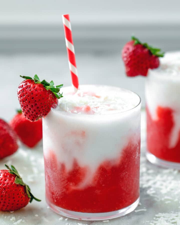 Strawberry Coconut Daiquiri -- Wishing you were on a tropical island? This Strawberry Coconut Daiquiri is an easy-to-make rum-based frozen cocktail that will have you feeling like you're on a beach vacation! | wearenotmartha.com #frozendrinks #frozencocktails #daiquiris #tropicaldrinks #rumdrinks