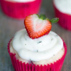 Strawberry Cupcakes with Mint Goat Cheese Buttercream -- Mint goat cheese frosting? Yes! It goes perfectly on these strawberry cupcakes packed with fresh strawberry filling. The best way to say hello to spring! | wearenotmartha.com