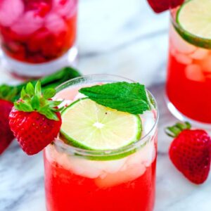 Strawberry Mojitos -- These Strawberry Mojitos are made with fresh strawberries, mint, rum, simple syrup, and lime juice and are the only cocktail you'll need this summer | wearenotmartha.com