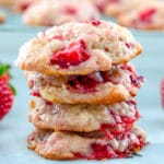 Head-on view of stack of 4 strawberry shortcake cookies with more cookies in background