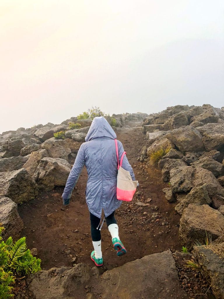 Sues walking down from the summit at Haleakala after not seeing the sun rise