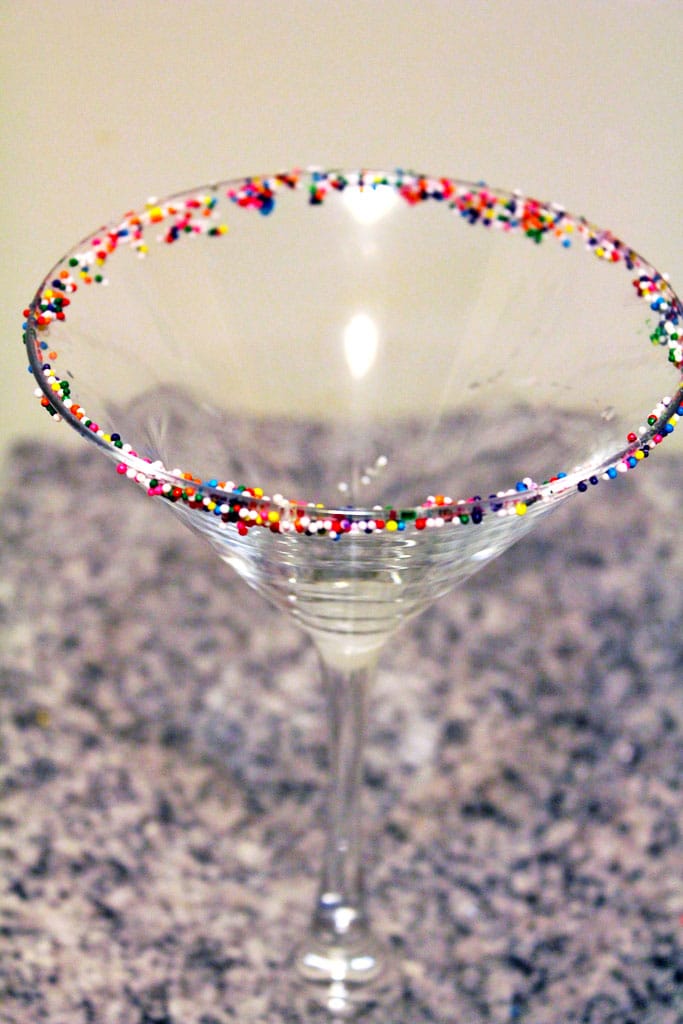 Overhead view of a martini glass with sprinkles on rim