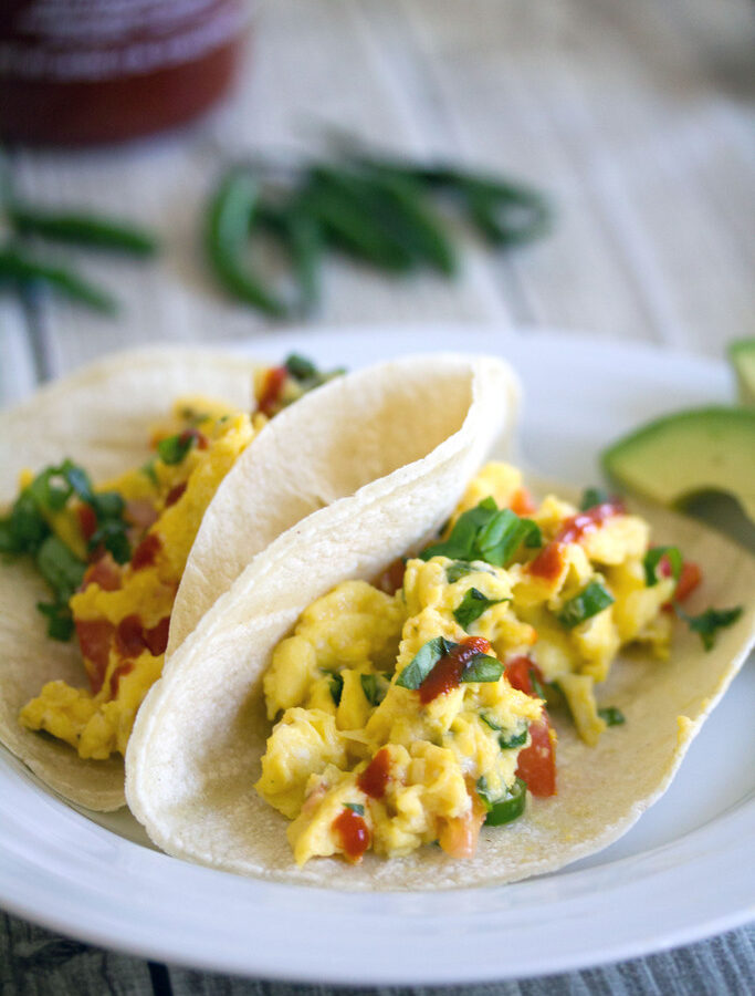 Thai Scrambled Egg Tacos -- These Thai Scrambled Egg Tacos take creamy scrambled eggs packed with spicy Thai flavors and serve them on tortillas for a breakfast you'll dream about | wearenotmartha.com