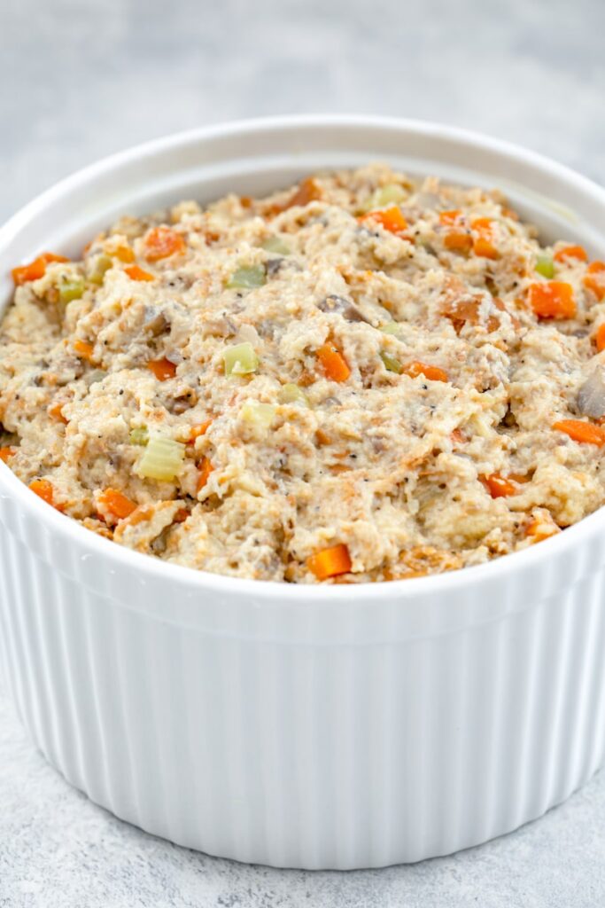 Stuffing mixture scooped into casserole dish