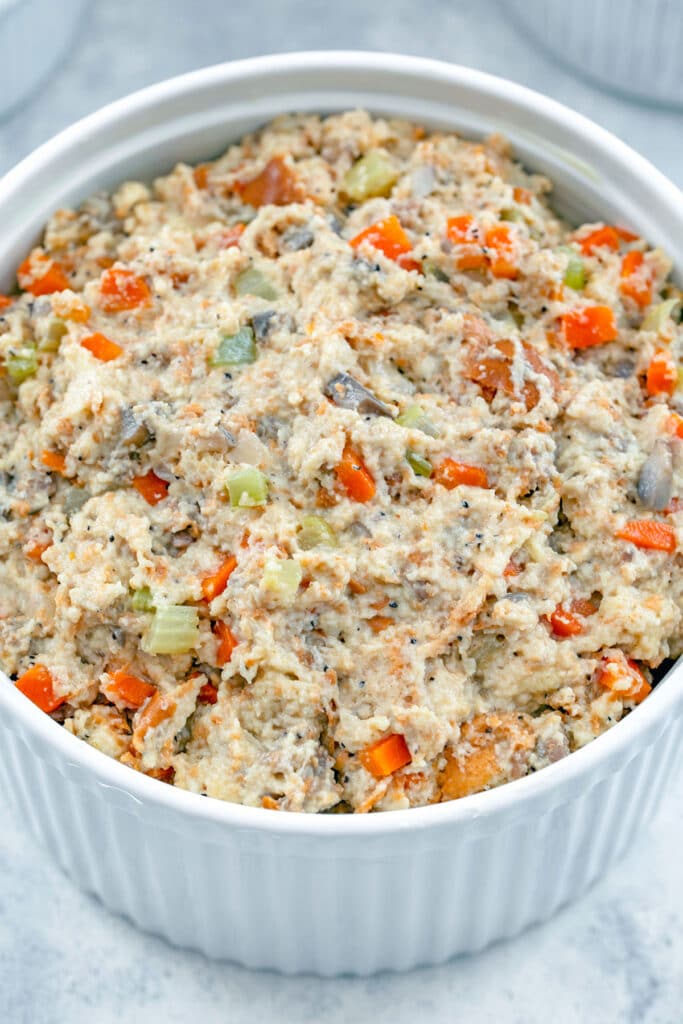 Stuffing mixture scooped into casserole dish.