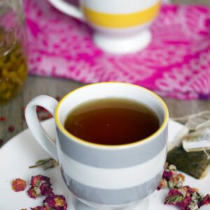 English Rose Cocktail -- This English Rose Cocktail combines rose-infused vodka, pink peppercorn simple syrup, and black tea for the most perfectly warming winter tea cocktail | wearenotmartha.com