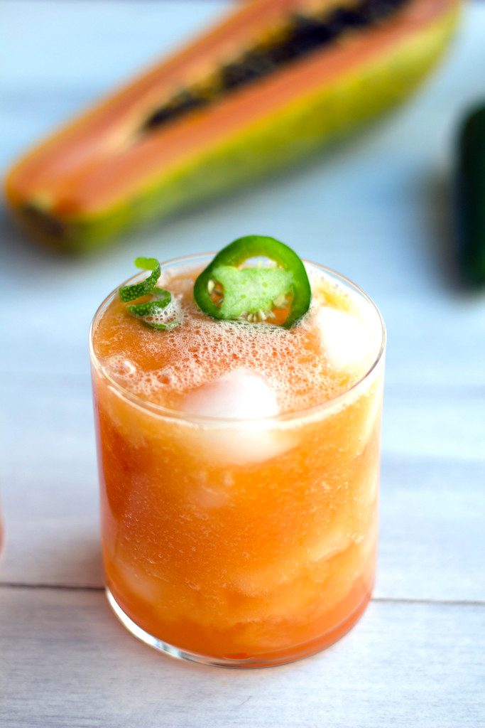 Tropical Papaya Jalapeno Refresher -- A spicy papaya cocktail with tequila, coconut water, and lime |wearenotmartha.com