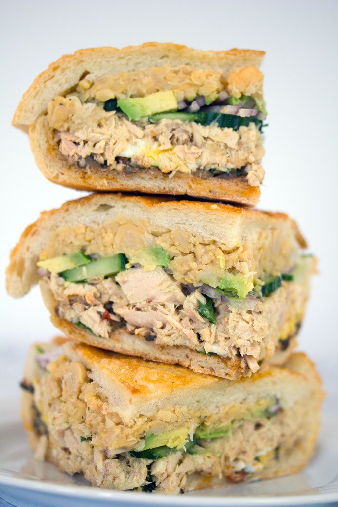 Tuna Nicoise Sandwich -- The layered sandwich includes tuna, eggs, avocado, chickpeas, and more! | wearenotmartha.com