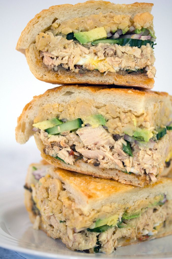 Tuna Nicoise Sandwich -- The layered sandwich includes tuna, eggs, avocado, chickpeas, and more! | wearenotmartha.com