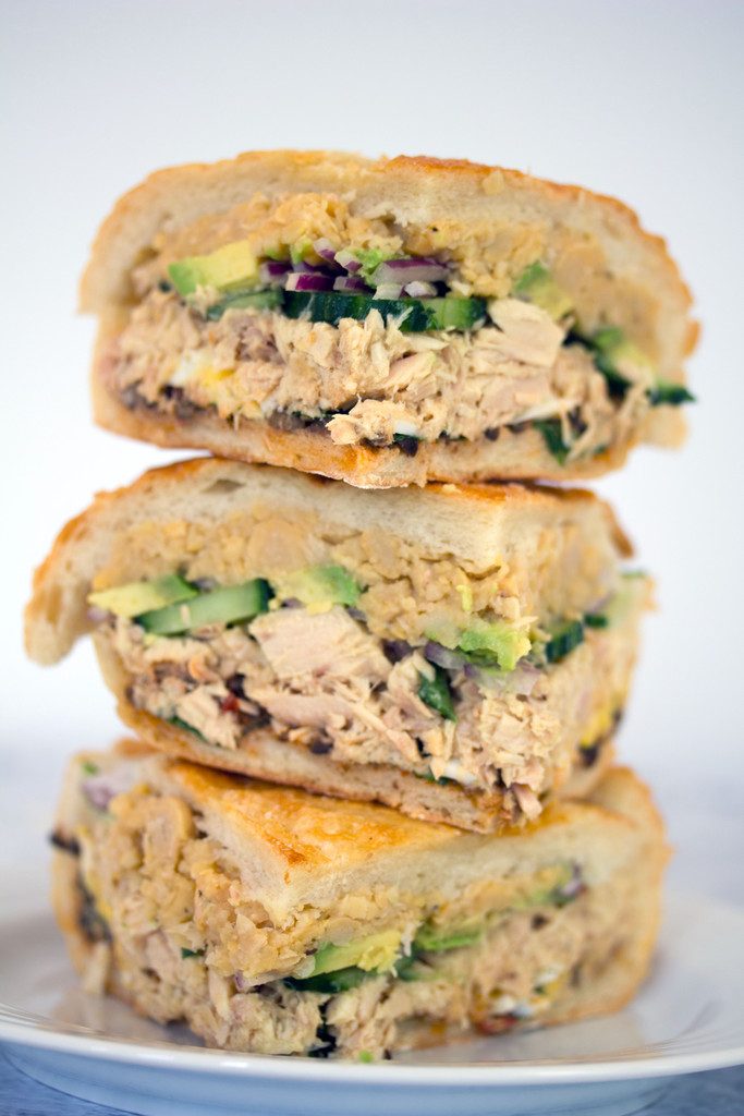 Tuna Nicoise Sandwich -- The layered sandwich includes tuna, eggs, avocado, chickpeas, and more! | wearenotmartha.com