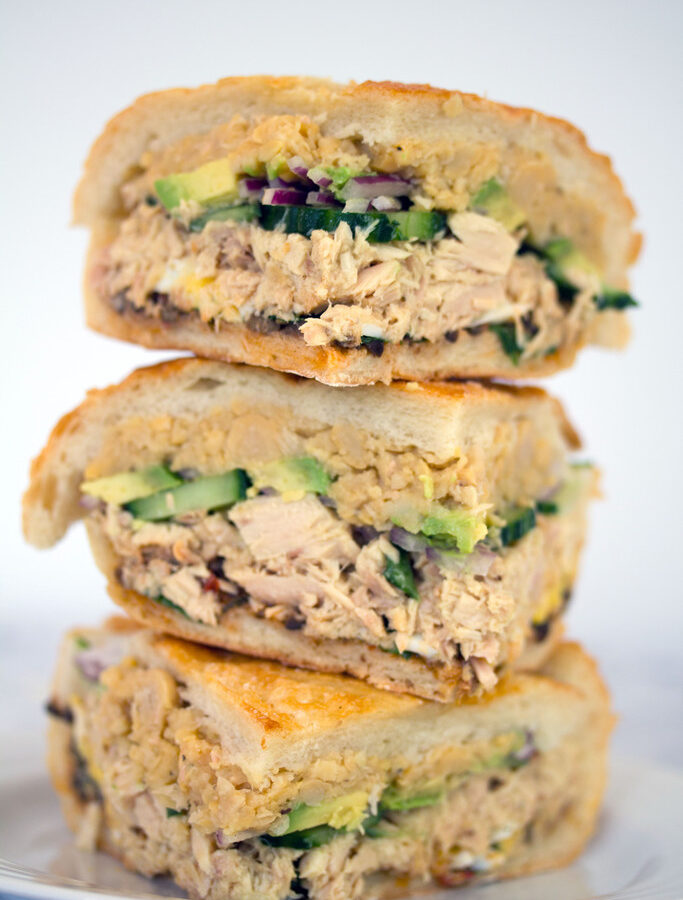 Tuna Nicoise Sandwich -- The layered sandwich includes tuna, eggs, avocado, chickpeas, and more! | wearenotmartha.com