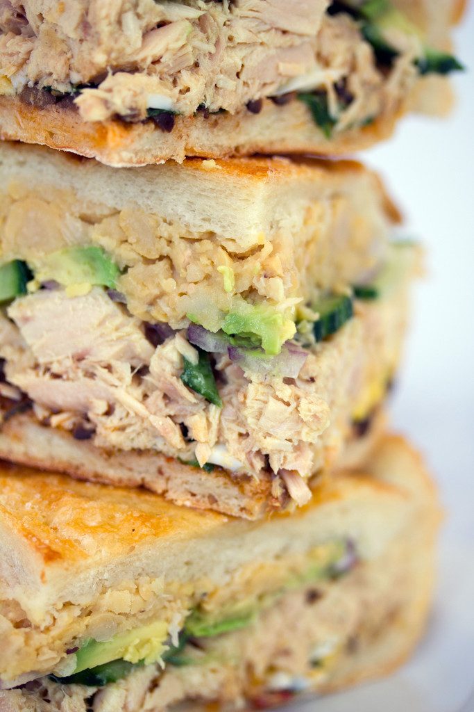 Tuna Nicoise Sandwich -- The layered sandwich includes tuna, eggs, avocado, chickpeas, and more! | wearenotmartha.com