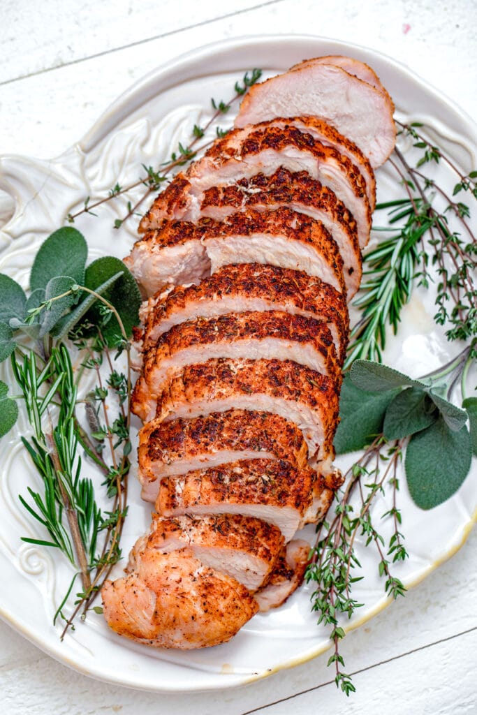 Overhead view of chili-rubbed turkey breast on platter.