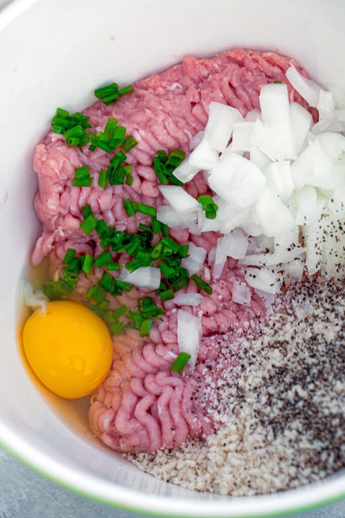 Ground turkey, panko, diced onion, chives, egg, salt, and pepper in a mixing bowl