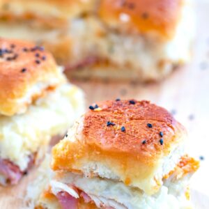 Turkey, Ham, and Swiss BBQ Reuben Sliders -- Looking for an easy party recipe that will take no time at all and seriously impress your guests? These BBQ Reuben Sliders can be prepped in mere minutes and will be loved by everyone | wearenotmartha.com