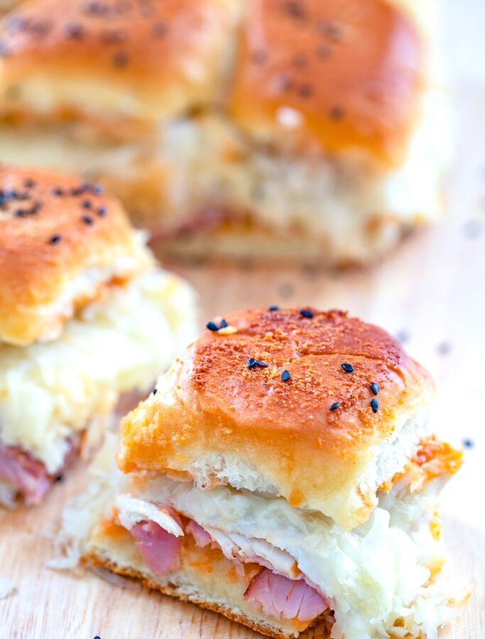 Turkey, Ham, and Swiss BBQ Reuben Sliders -- Looking for an easy party recipe that will take no time at all and seriously impress your guests? These BBQ Reuben Sliders can be prepped in mere minutes and will be loved by everyone | wearenotmartha.com