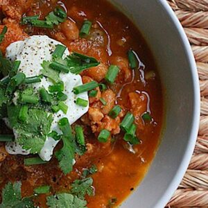 Turkey White Bean Pumpkin Chili -- This Turkey White Bean Pumpkin Chili is a healthy chili made with ingredients that are nutritious, but also totally satisfying. Prep the slow cooker chili in the morning and dinner will be ready by the time you get home from work | wearenotmartha.com