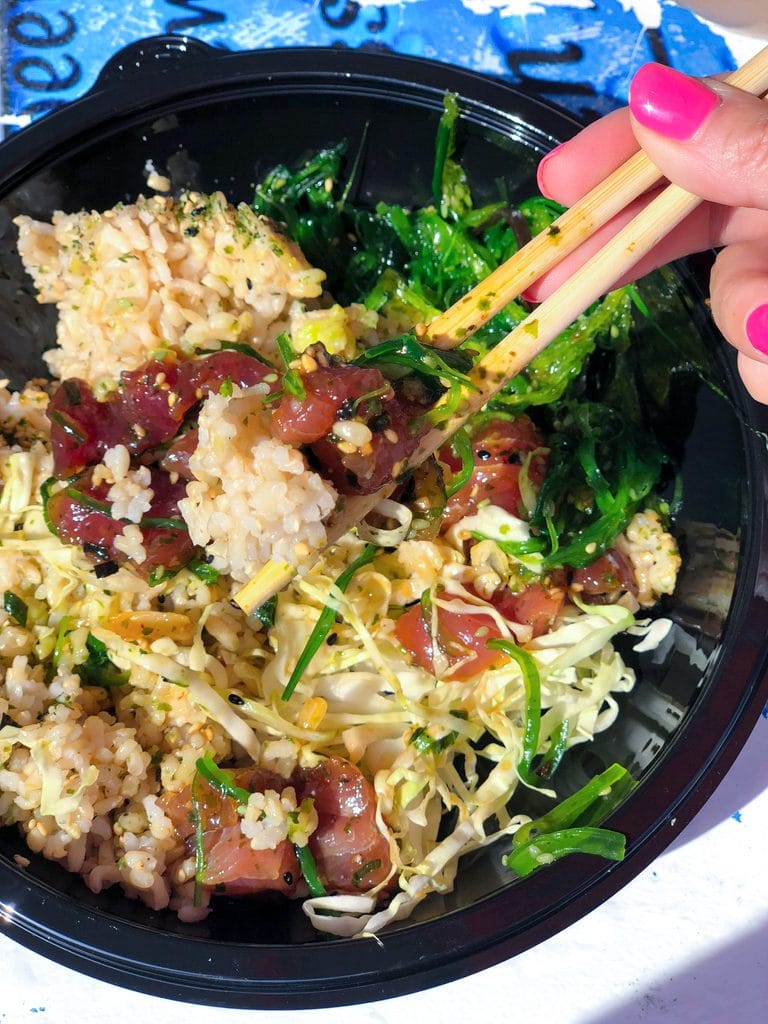 Poke bowl with lots of tuna, seaweed salad, and brown rice all mixed together with chopsticks at Umeke's in Kona on the Big Island of Hawaii