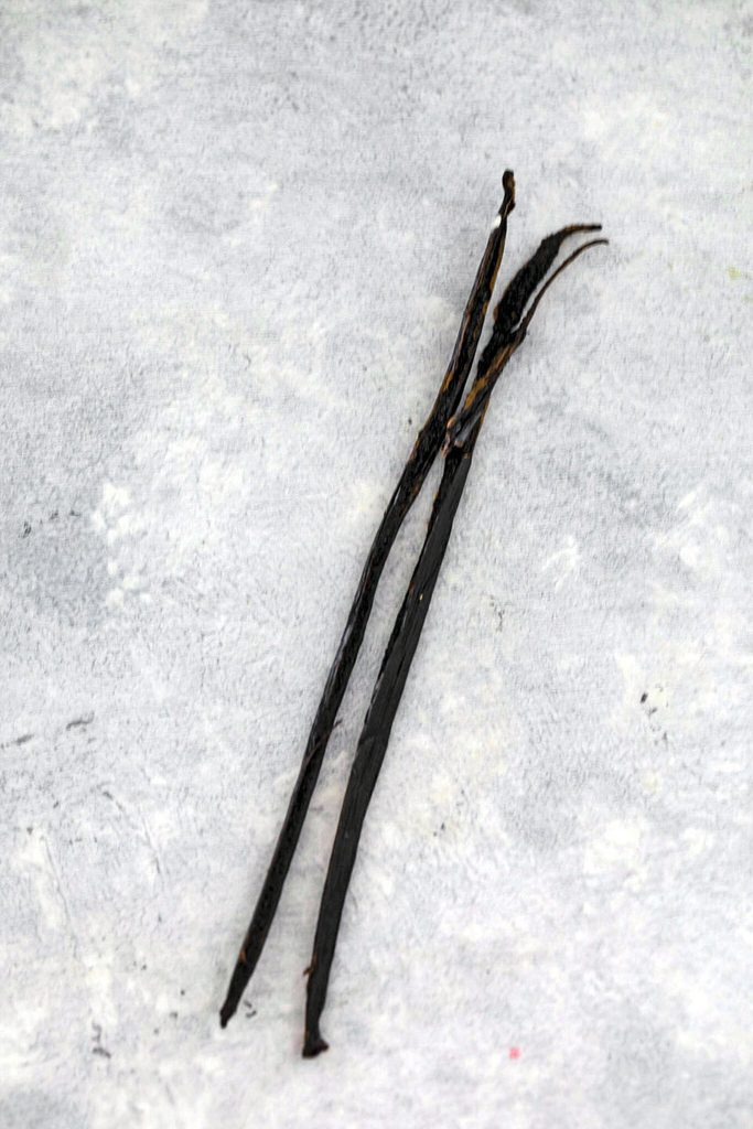 Overhead view of vanilla beans on the counter