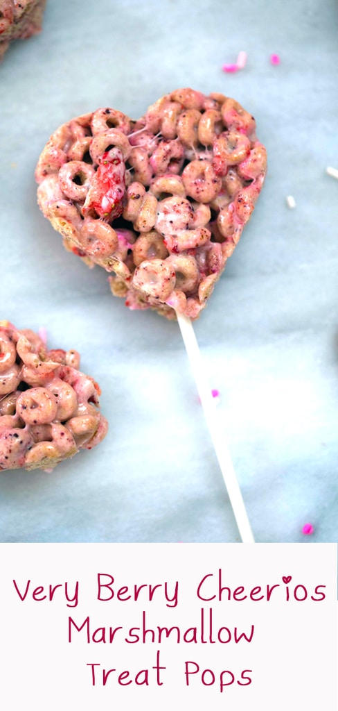 Very Berry Cheerios Marshmallow Treat Pops -- These Very Berry Cheerios Marshmallow Treat Pops are heart-shaped Rice Krispies treats style pops perfect for Valentine's Day or any time you want to show your love! | wearenotmartha.com #cheerios #cheeriostreats #valentinesday