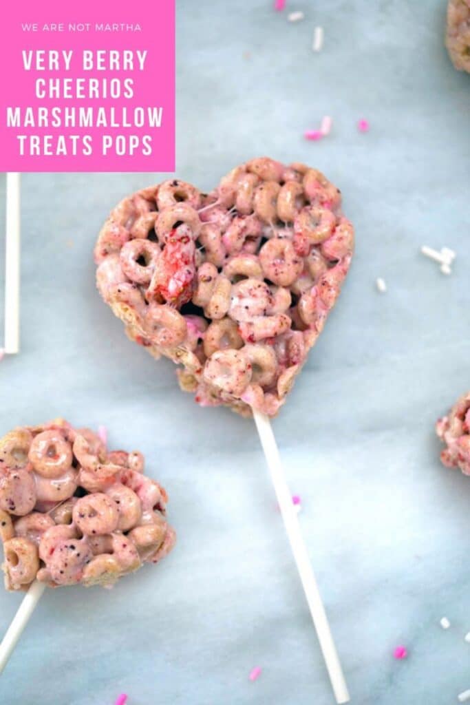 Very Berry Cheerios Marshmallow Treat Pops -- These Very Berry Cheerios Marshmallow Treat Pops are heart-shaped Rice Krispies treats style pops perfect for Valentine's Day or any time you want to show your love! | wearenotmartha.com