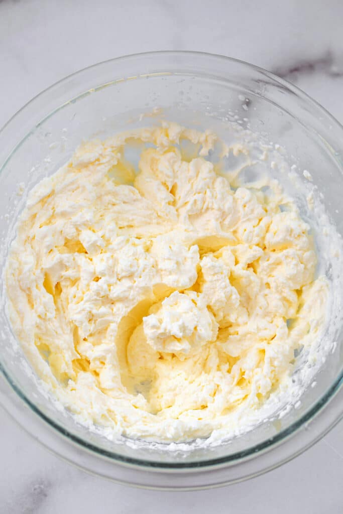 Overhead view of homemade whipped cream in a bowl