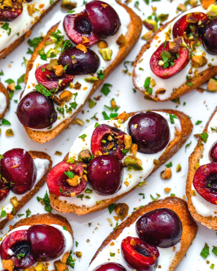 Whipped Ricotta and Cherry Crostini -- Looking for an easy but impressive summer appetizer? These Whipped Ricotta Cherry Crostini are quick and easy to prepare and will wow your guests! | wearenotmartha.com #crostini #partyappetizers #cherryrecipes #summerrecipes #appetizers