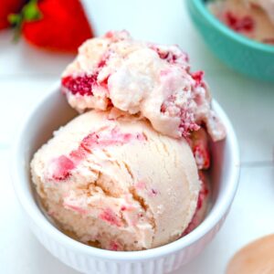White Chocolate Strawberry Ice Cream -- This White Chocolate Strawberry Ice Cream is incredibly easy to make (waiting for it to chill is the toughest part!) and packed with fresh strawberries and creamy white chocolate for a delicious spring or summer dessert | wearenotmartha.com