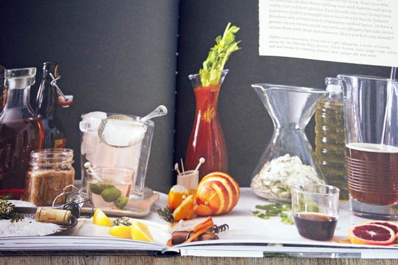 Overhead view of open Winter Cocktails book showing various cocktails