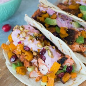 Winter Salmon Tacos with Butternut Squash Salsa and Cranberry Crema -- These fish tacos let you celebrate the winter season while sticking to a healthy eating plan! Packed with lots of winter flavors, algae oil is used to boost good fats | wearenotmartha.com