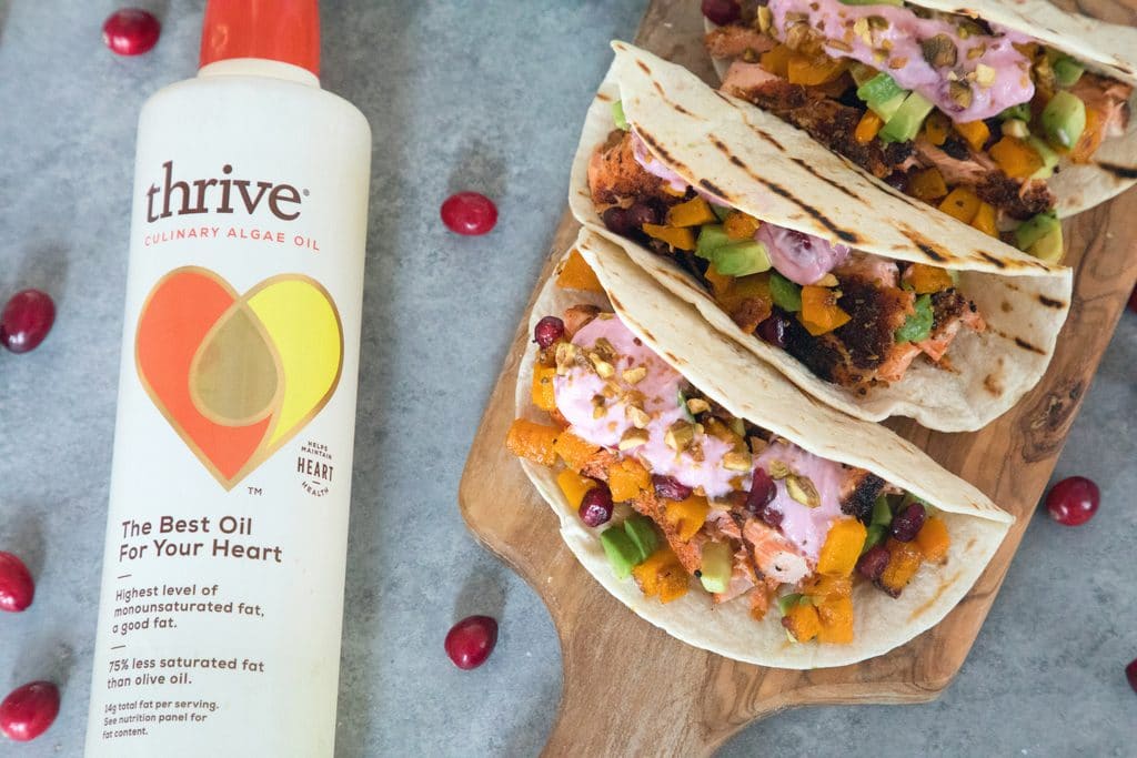 Winter Salmon Tacos with Butternut Squash Salsa and Cranberry Crema -- These fish tacos let you celebrate the winter season while sticking to a healthy eating plan! Packed with lots of winter flavors, algae oil is used to boost good fats | wearenotmartha.com