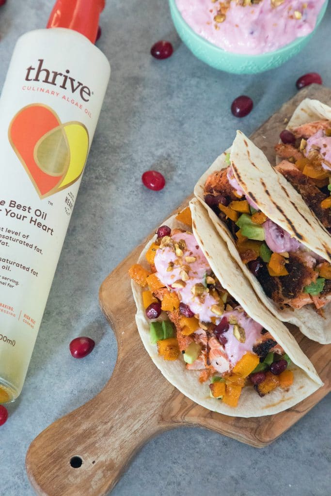 Winter Salmon Tacos with Butternut Squash Salsa and Cranberry Crema -- These fish tacos let you celebrate the winter season while sticking to a healthy eating plan! Packed with lots of winter flavors, algae oil is used to boost good fats | wearenotmartha.com