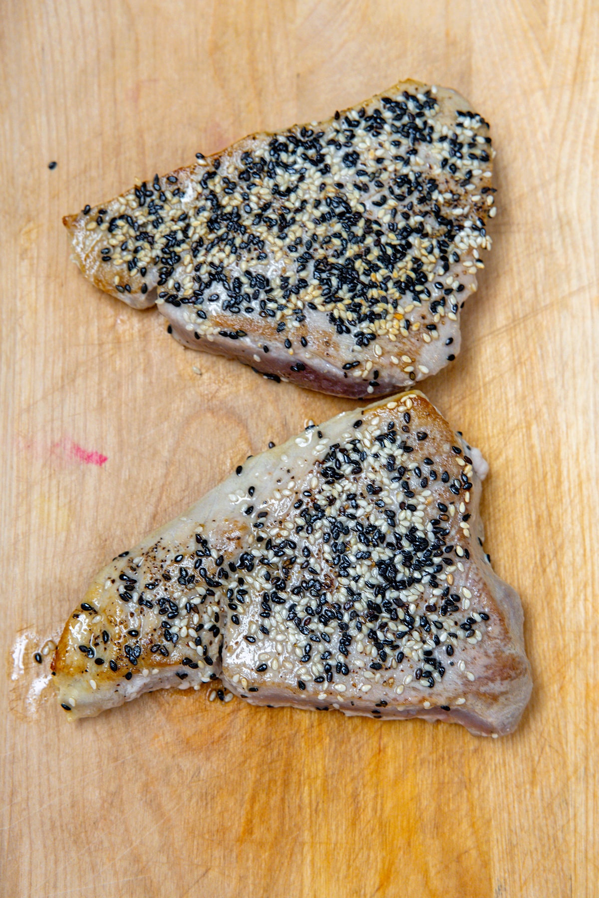 Seared tuna steaks with sesame seeds.