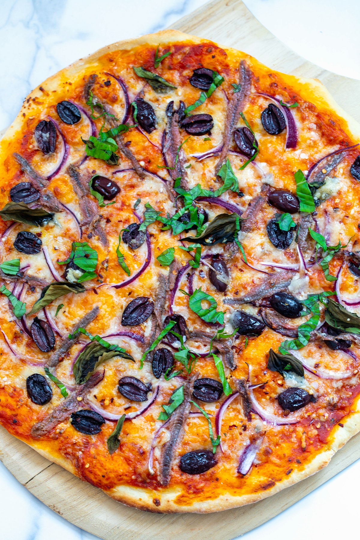Full anchovy pizza just out of the oven.